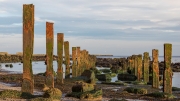 The ocean takes back everything - remains of an old pier